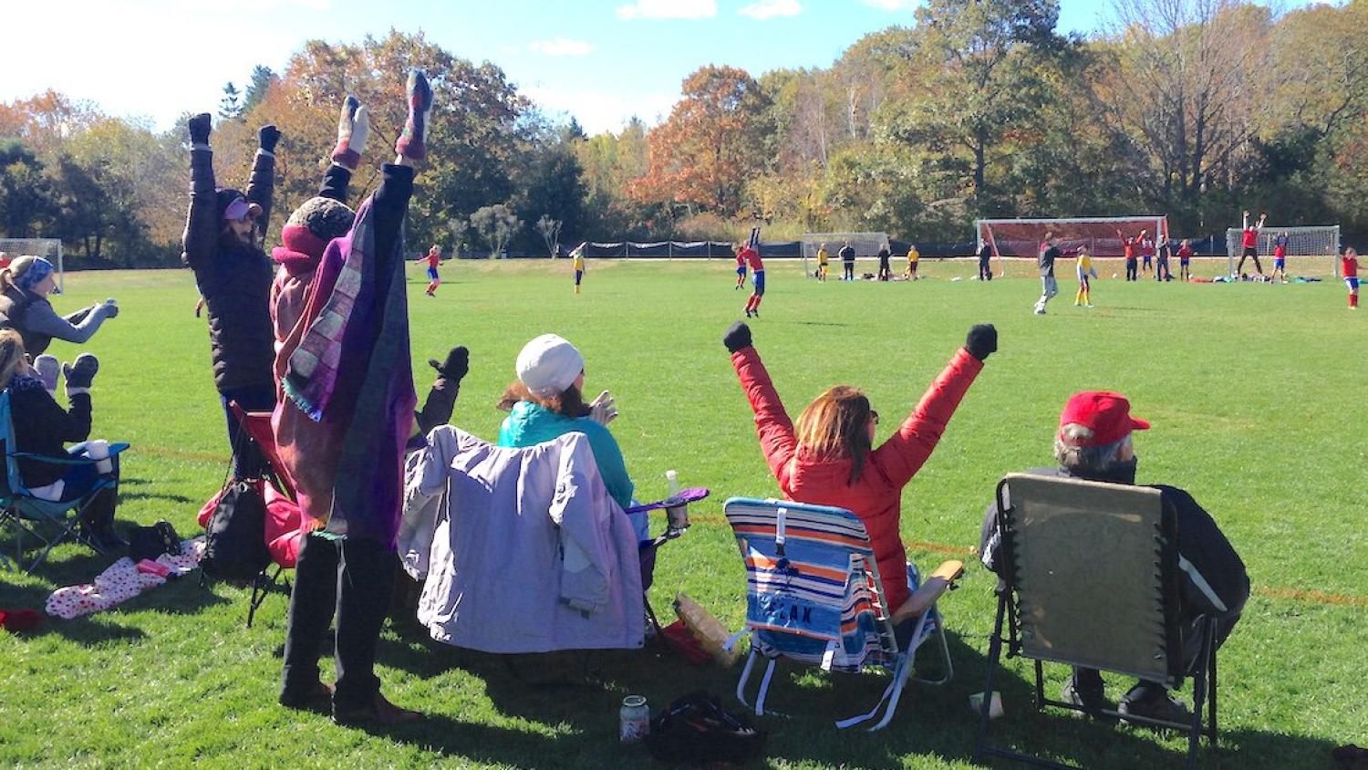 PPFC banner and team members at an event